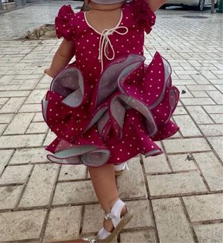 Traje de flamenca rosa con lunares blancos