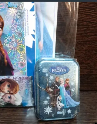 25 sobres cromos Frozen Disney + archivador + lata