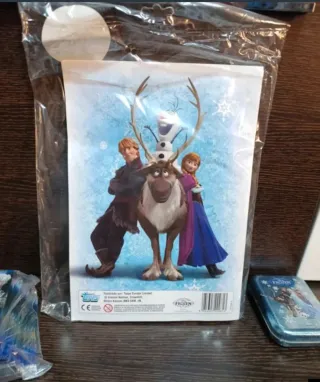 25 sobres cromos Frozen Disney + archivador + lata