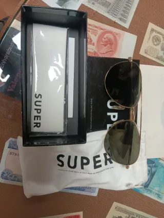 Gafas de sol dkny negras y doradas