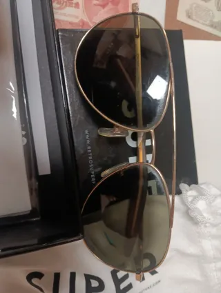 Gafas de sol dkny negras y doradas