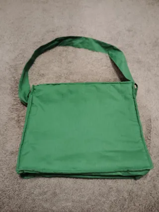 Bolsa de bebé con muñeco de payaso.