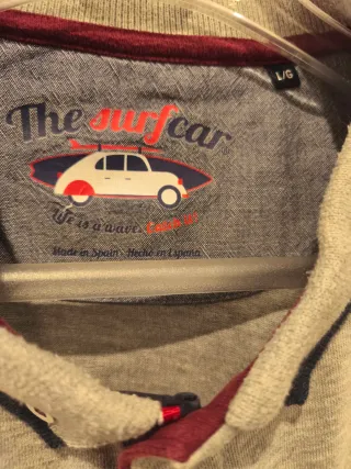 Polo gris manga larga hombre.