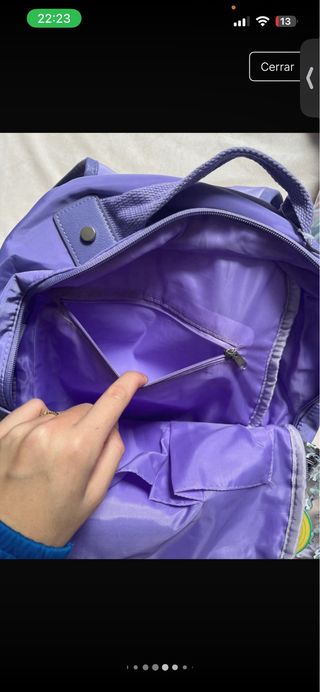 Mochila morada con monedero