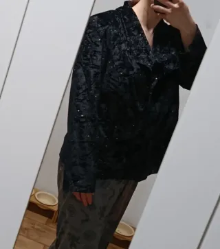 Chaqueta fiesta negra con brillos plateados