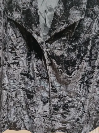 Chaqueta fiesta negra con brillos plateados