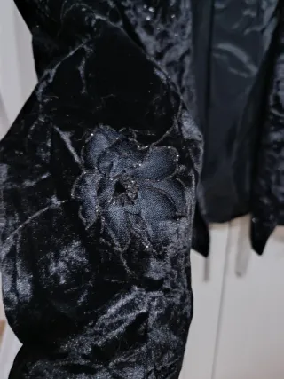 Chaqueta fiesta negra con brillos plateados