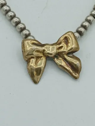 Bracciale sfere argento 925 con fiocco dorato