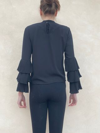 Blusa Eclipse nera con rouches