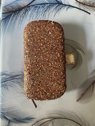 Bolso de mano brillante dorado y multicolor