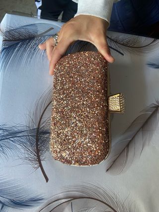 Bolso de mano brillante dorado y multicolor