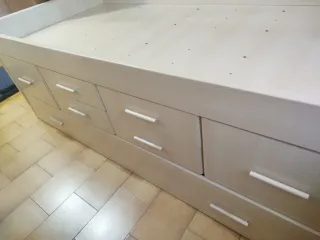 Cama alta individual con cajones