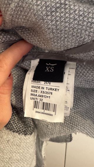 Abrigo largo de paño a rayas con bolsillos