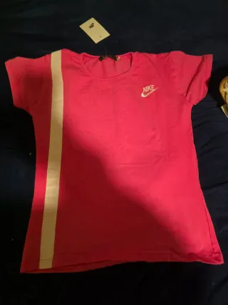 Conjunto deportivo Nike rosa y negro