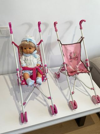 Muñeca bebé con chupete y gorrito mas carritos