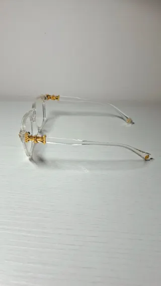 Occhiali trasparenti con dettagli oro
