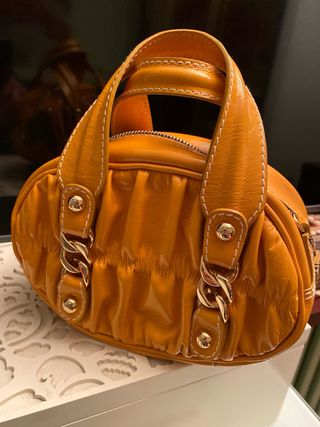 Bolso Tous mostaza y dorado