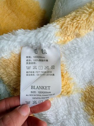 Manta suave a cuadros amarilla y blanca