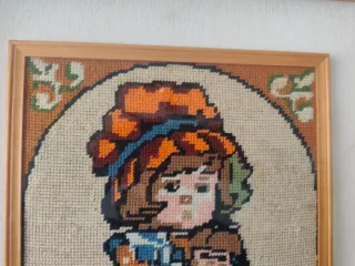 Quadro a mezzopunto con bambina. Misure 42x52.