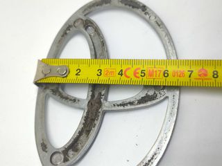 Simbolo Toyota 125x85mm frente traseira usado orig