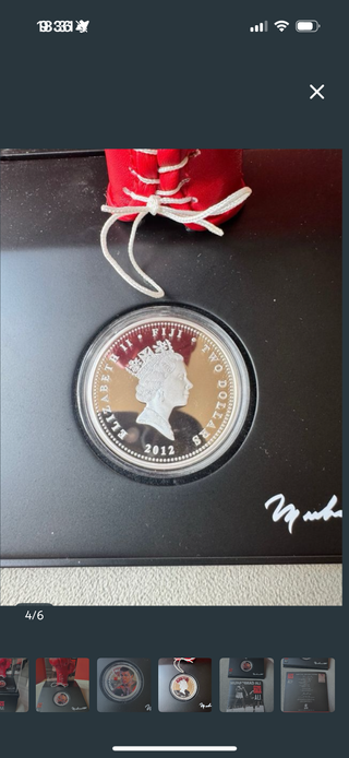 Guante y moneda Muhammad Ali