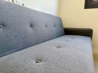 Sofá cama gris a estrenar sin uso.