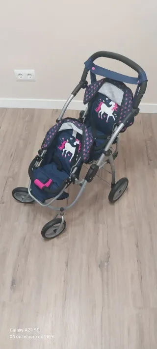 Cochecito de juguete doble con unicornios