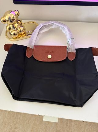 Mala de mão preta e castanha