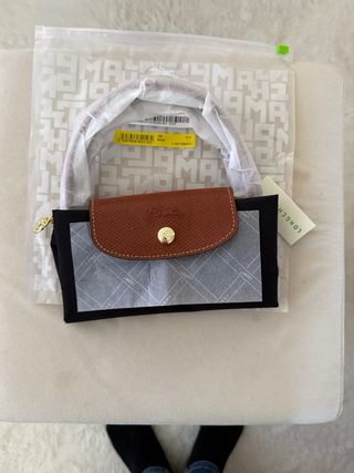 Mala de mão preta e castanha