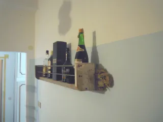 Portabottiglie in legno e metallo