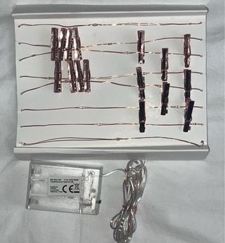 Grinalda luminosa com clipes para fotografias