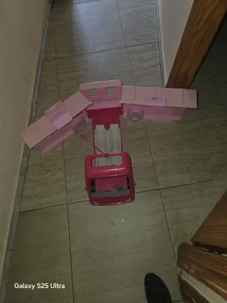Casa rodante de juguete rosa para muñecas