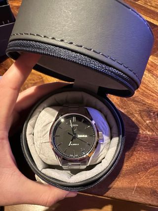 Reloj TAG Heuer Negro y Plateado.