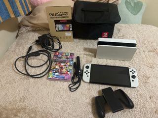 Nintendo Switch OLED + Mario Kart + Mario Wonder