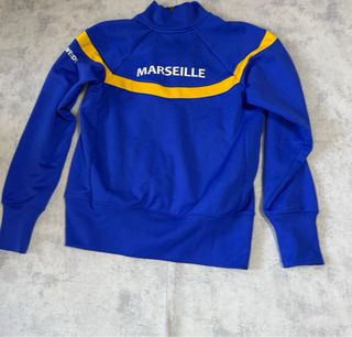 Chaqueta deportiva TYR azul y amarilla