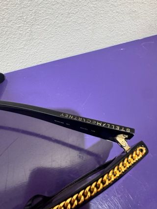 Occhiali da sole Stella McCartney neri e oro