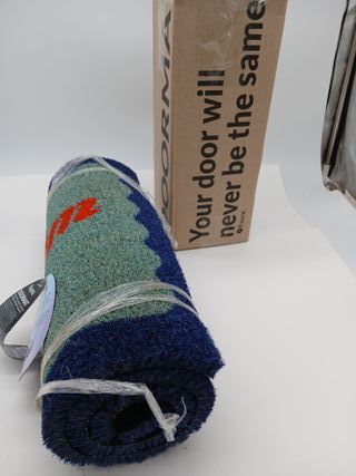 FISURA - Zerbino ingresso casa "com més serem" di cocco con base antiscivolo in PVC. Zerbino originale blu e rosso.