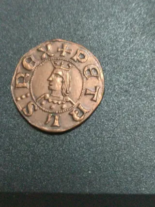 Moneda antigua con retrato de rey