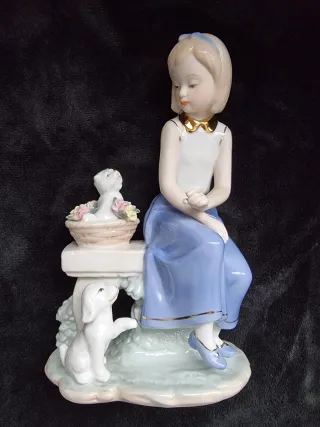 Figura de porcelana niña y perros