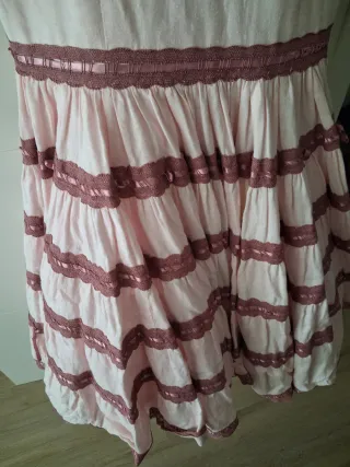 Traje de flamenca rosa con volantes