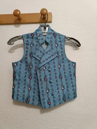 Chaleco fallero azul floral Talla como para 7años
