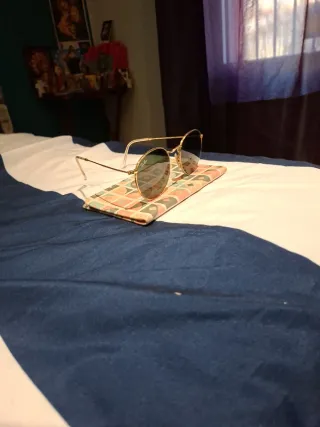 Gafas de sol Ray-Ban redondas doradas