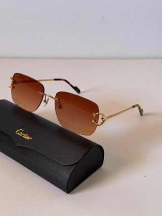 Gafas de sol Cartier doradas y marrones