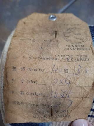 Tappeti azzurri e beige con frange