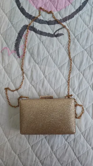 Bolso de mano dorado champán