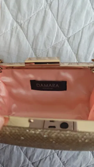 Bolso de mano dorado champán