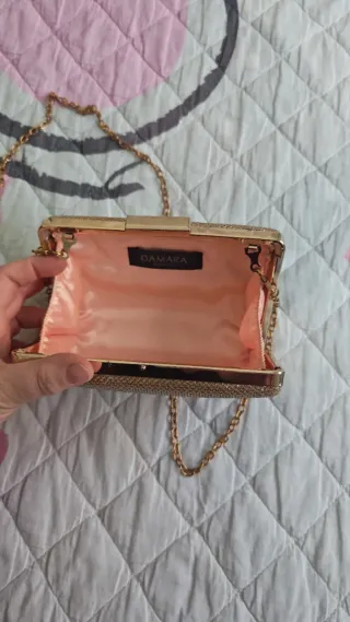 Bolso de mano dorado champán