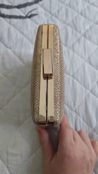 Bolso de mano dorado champán