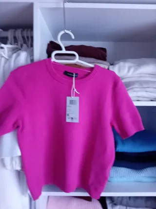 Jersey rosa y prenda de regalo