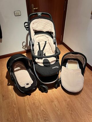 Carro de bebé negro y beige